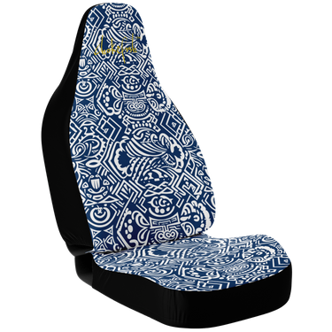 A custom car seat cover featuring a geometric Maori design in blue and white patterns on a black background.